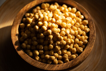 Wall Mural - Chickpea in a wooden plate. Food photography