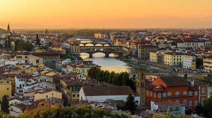 Canvas Print - The Florence cityscape with the Ponte Vecchio over Arno river in an orange sunset.