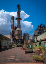 Abandoned Sugar Mill With Rusty Smoke Stack