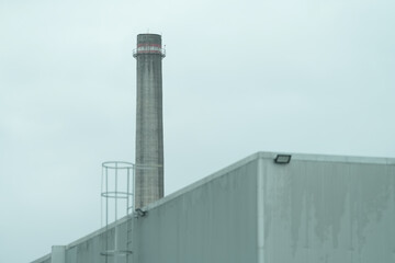 Wall Mural - The chimney of a thermal power plant, the smoke extracted by a thermal power plant on the chimney, in the production process. Environment. Pollution.