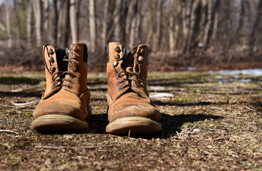 Worn, rugged leather work boots.