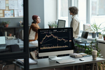 Fototapete - Focus on computer screen with graphic data obtained by analyst or broker after analyzing online statistics describing changes on stock market