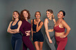 © gpointstudio - Group of five young women in sports clothes in studio shot