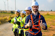 © 1st footage - technician working outdoor at wind turbine field. Renewable energy engineer working on wind turbine projects, Environmental engineer research and develop approaches to providing clean energy sources