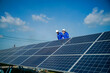 © FotoArtist - Technology solar cell, Engineer service check installation solar cell on the roof of factory. technician checks the maintenance of the solar panels