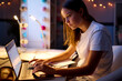 © Monkey Business - Teenage Girl Studying At Home With Laptop In Bedroom Desk At Night