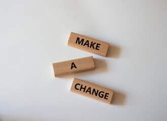 Wall Mural - Make a change symbol. Concept words Make a change on wooden blocks. Beautiful white background. Business and Make a change concept. Copy space.