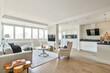 © ADDICTIVE STOCK - Spacious living room with kitchen furniture