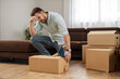 © ivanko80 - Young man packing order for shipping to customer