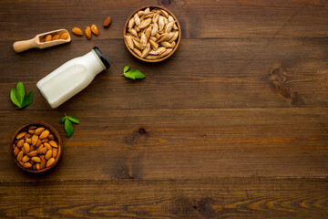 Wall Mural - Vegan organic drink - almond milk with almond nuts, top view