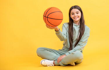 teen basketball girl hold ball in studio. teen basketball girl on background.