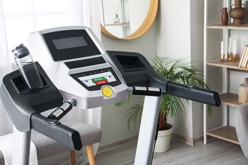 Wall Mural - Modern treadmill in light room, closeup