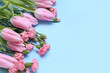Beautiful tulip and carnation flowers on color background, closeup. Women's Day celebration