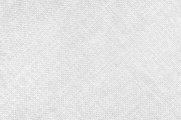 Jacquard woven upholstery, white coarse fabric texture with diagonal weave lines. Textile background, furniture textile material, wallpaper, backdrop. Cloth structure close up.