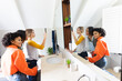 © Wavebreak Media - Happy diverse teenage female friends taking selfie in front of mirror