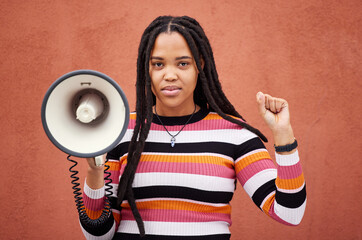 Megaphone, portrait or black woman protest with speech announcement for politics, equality or human rights. Feminist leader, revolution or gen z girl with sound device for justice on wall background