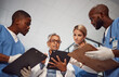 © Courtney/peopleimages.com - Tablet, teamwork and group of doctors in hospital management, results and medical data with manager. Nurse, professional healthcare people and technology of clinic review, planning or problem solving