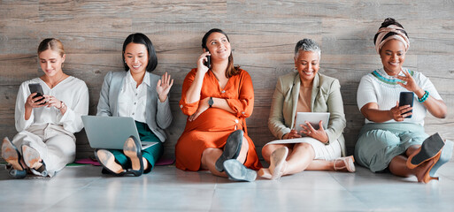 Canvas Print - Collaboration, technology and diversity with a business team sitting on the floor in their office for work. Teamwork, communication and corporate design with a woman employee group working together