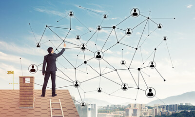 Businessman on house roof presenting networking and connection c