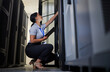 © Nina L/peopleimages.com - Server room, engineer and woman with tablet for database connection cable, maintenance or software update at night. Cybersecurity, it and female coder with technology for networking in data center.