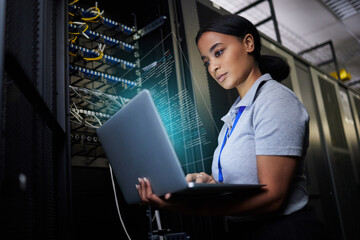 Leinwandbilder - Laptop, network and data center with a black woman it support engineer working in a dark server room. Computer, cybersecurity and analytics with a female programmer problem solving or troubleshooting