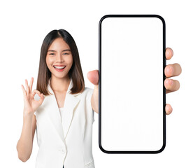 beautiful asian woman holding smartphone mockup of blank screen and shows ok sign on screen backgrou