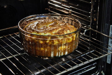 Canvas Print - Cauliflower souffle in a transparent bowl in the oven after baking