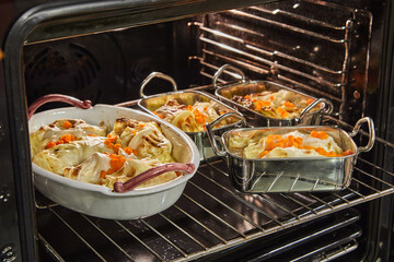 Poster - Cabbage rolls with salmon, carrots and sauce are baked in the oven. French recipe