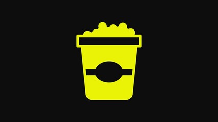 Poster - Yellow Popcorn in cardboard box icon isolated on black background. Popcorn bucket box. 4K Video motion graphic animation