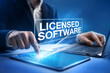© ProstoSvet - Licensed software concept. Businessman uses licensed software