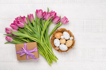 Wall Mural - Fresh pink tulip flowers and easter eggs