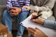 © Seventyfour - Family Psychologist Taking Notes