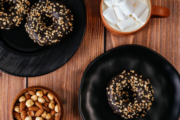 donut in chocolate glaze and nut sprinkles