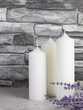 Three white candles with lavender