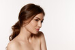 © master1305 - Portrait of young beautiful woman with perfect smooth skin isolated over white background. Glowing hair, well-kept skin. Concept of natural beauty, plastic surgery, cosmetology, cosmetics, skin care.