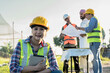 © Jack Tamrong - Engineer Construction woman working on site with builder and foreman explaining project to arab businessman background