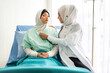 © Art_Photo - Muslim asian woman doctor service help support discussing and consulting talk to muslim woman patient at meeting health medical care express trust concept in hospital.healthcare and medicine