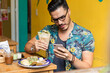© Luna Vandoorne - Mexican man eating healthy.