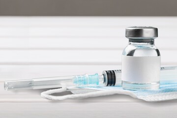 Poster - Medication vaccine in medical bottle on desk