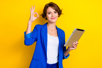 Wall Mural - Photo of charming positive lady dressed blue blazer showing okey chatting modern device isolated yellow color background