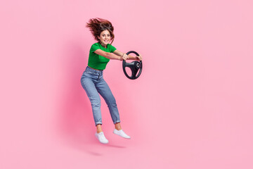 Sticker - Full length photo of pretty excited girl wear green crop top jumping high riding vehicle empty space isolated pink color background