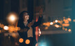 © Angelo/peopleimages.com - Black woman, phone and night business with bokeh mockup lights for network connection idea. Happy entrepreneur person smartphone ux interface in dark office for networking, contact and communication
