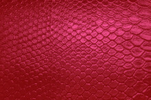 Red snakeskin reptile leather pattern texture background