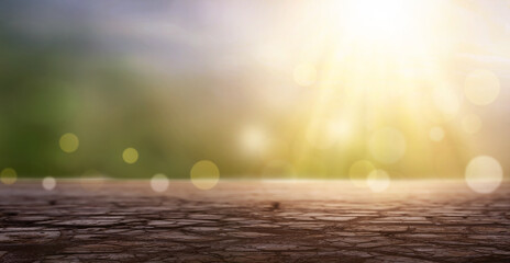 Wall Mural - esg concept:dry land and blue sky on abstract blur nature sunrise background
