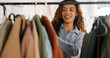 © Kirsten D/peopleimages.com - Woman designer, entrepreneur startup and clothes rack in modern workplace studio. Young happy girl smile, shop wardrobe manager and creative clothing fashion design professional working in store
