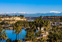 View Of Newport Beach Upper Back Bay And Snow Capped San Gabriel Mountains On A Sunny Winter Day