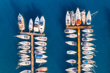 Aerial View Of Boats And Luxure Yachts In Dock At Sunset In Summer In Pula, Croatia. Colorful Landscape With Sailboats And Motorboats In Sea Bay, Jatty, Clear Blue Sea. Drone View Of Harbor. Travel