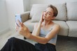 © SHOTPRIME STUDIO - Woman blogger selfies on phone, selfies and online conversations for followers, teenager develops social media, freelancer from home