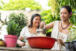 © Hector Pertuz - Women grind corn for family dinner