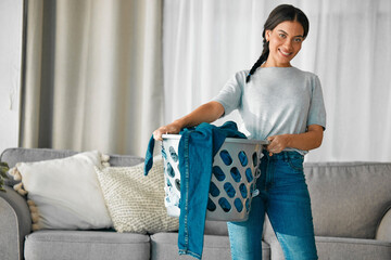 Canvas Print - Laundry, clothes and portrait of woman with basket for cleaning, housekeeping and maintenance at home. Housework, washing and happy girl in living room carry container for linen, fabric and material